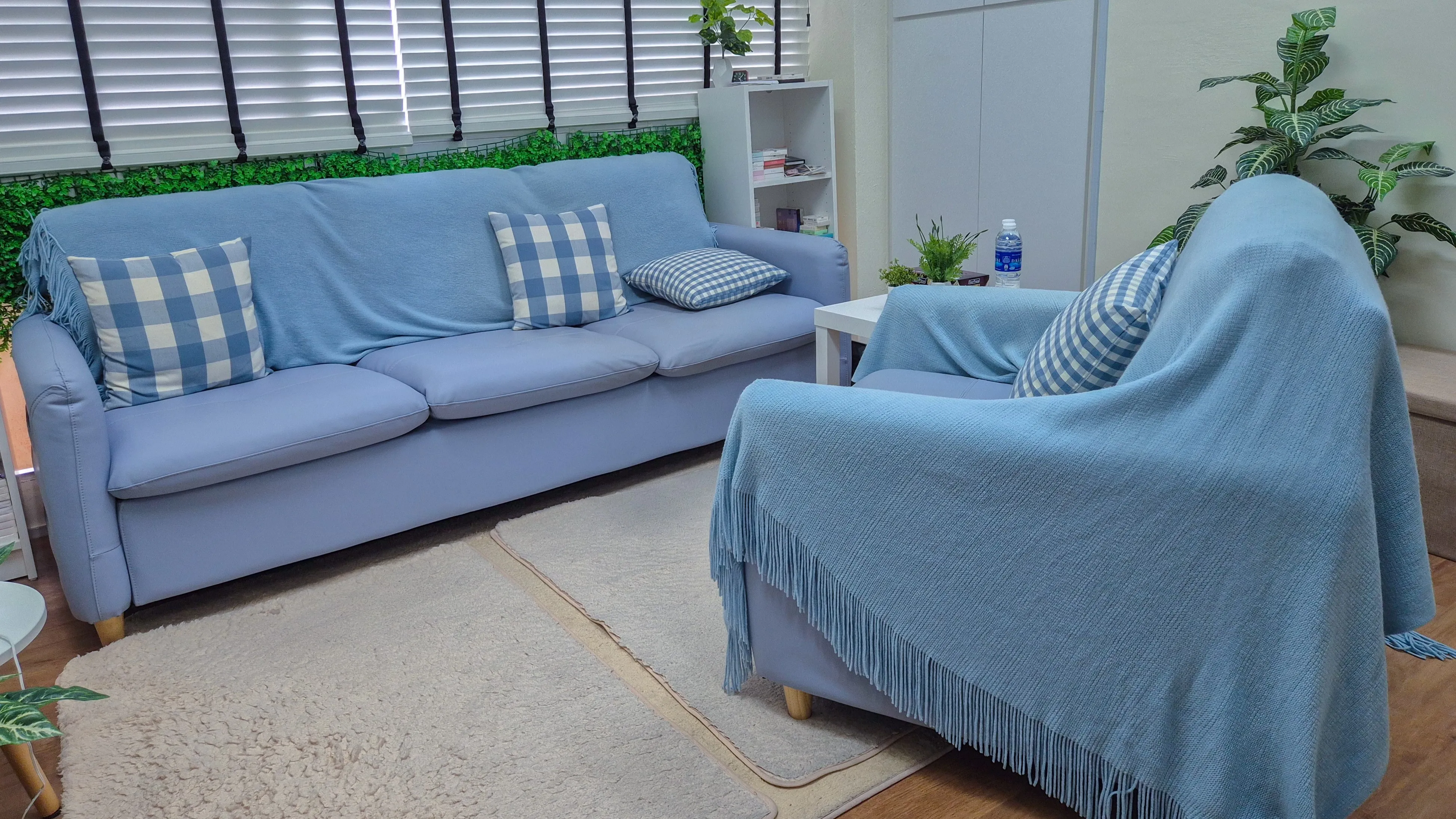 Private counselling room with blue seating at Emotional Wellness Counselling Singapore