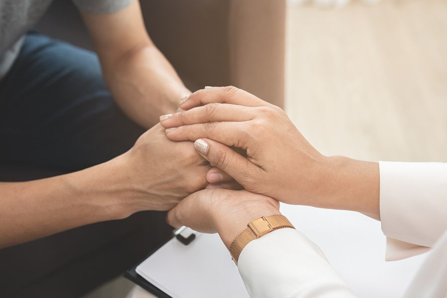 A picture of people holding hands to represent healing