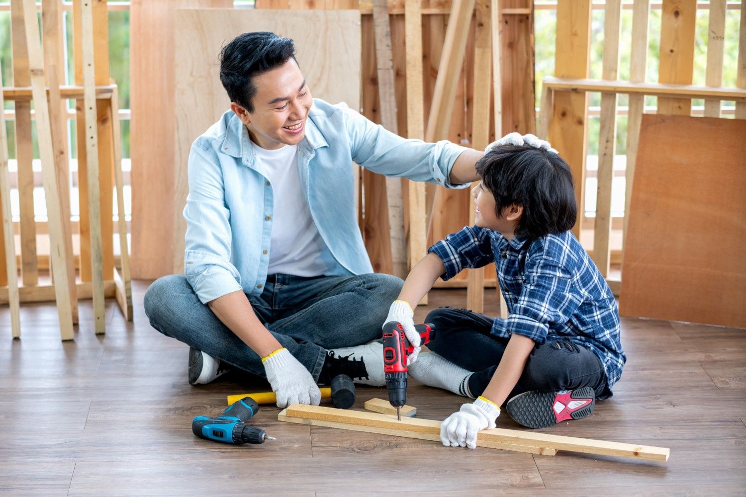 Parent and teenager smiling and working together